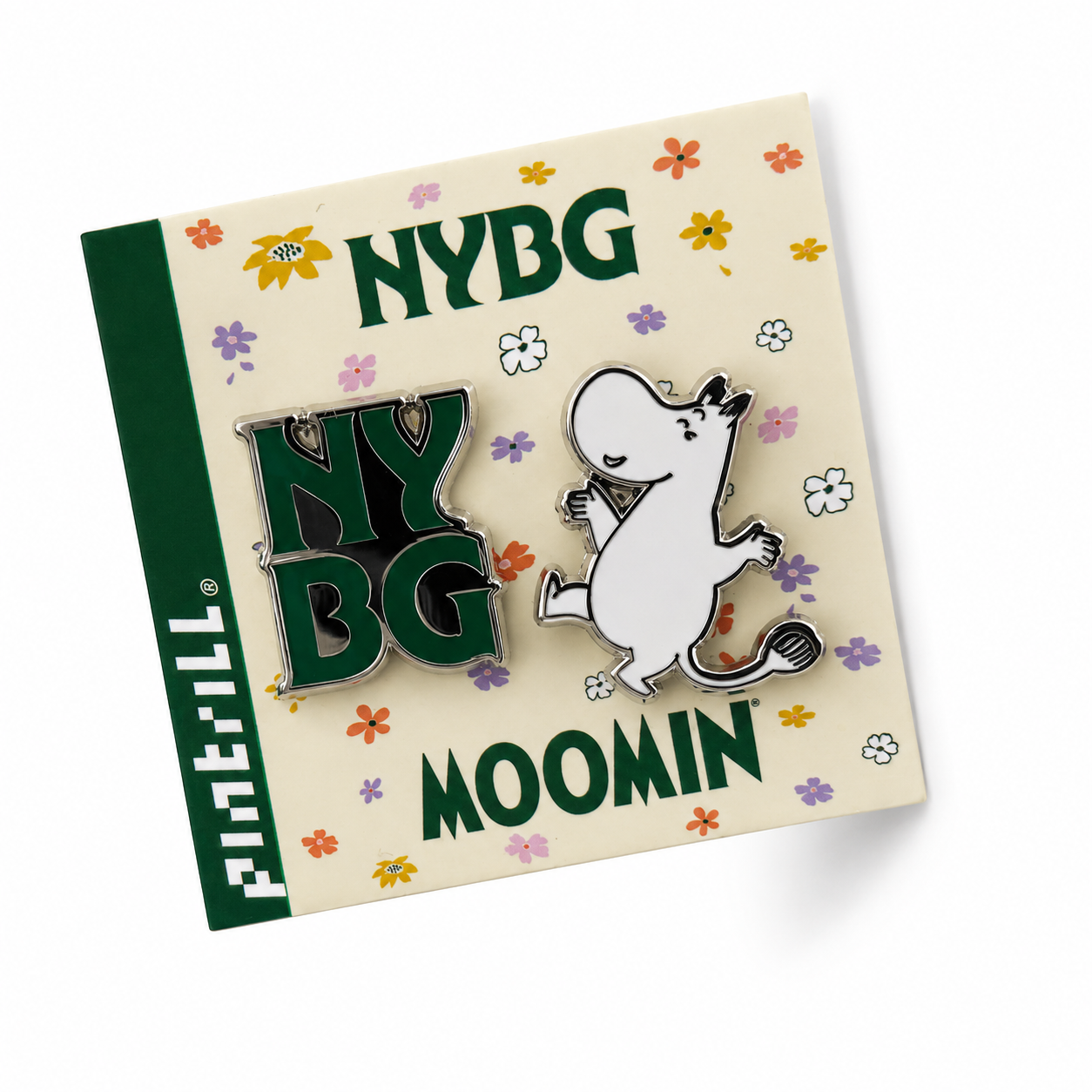 A Pintrill enamel pin set on its original backing card. The set includes a green and silver 'NYBG pin and a white Moomin pin with black and silver details.